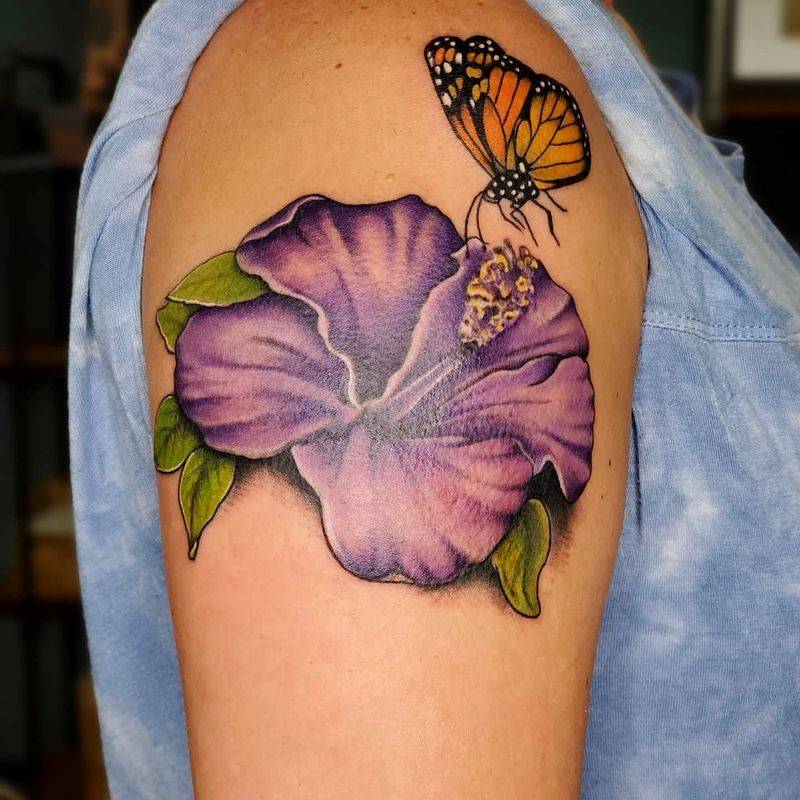flower and butterfly tattoo by custom tattoo artist at professional tattoo Artist in Watford