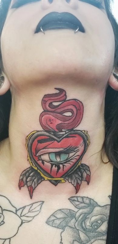 Delicate fine line neck tattoo for women performed at Soulful Ink Studios Watford City
